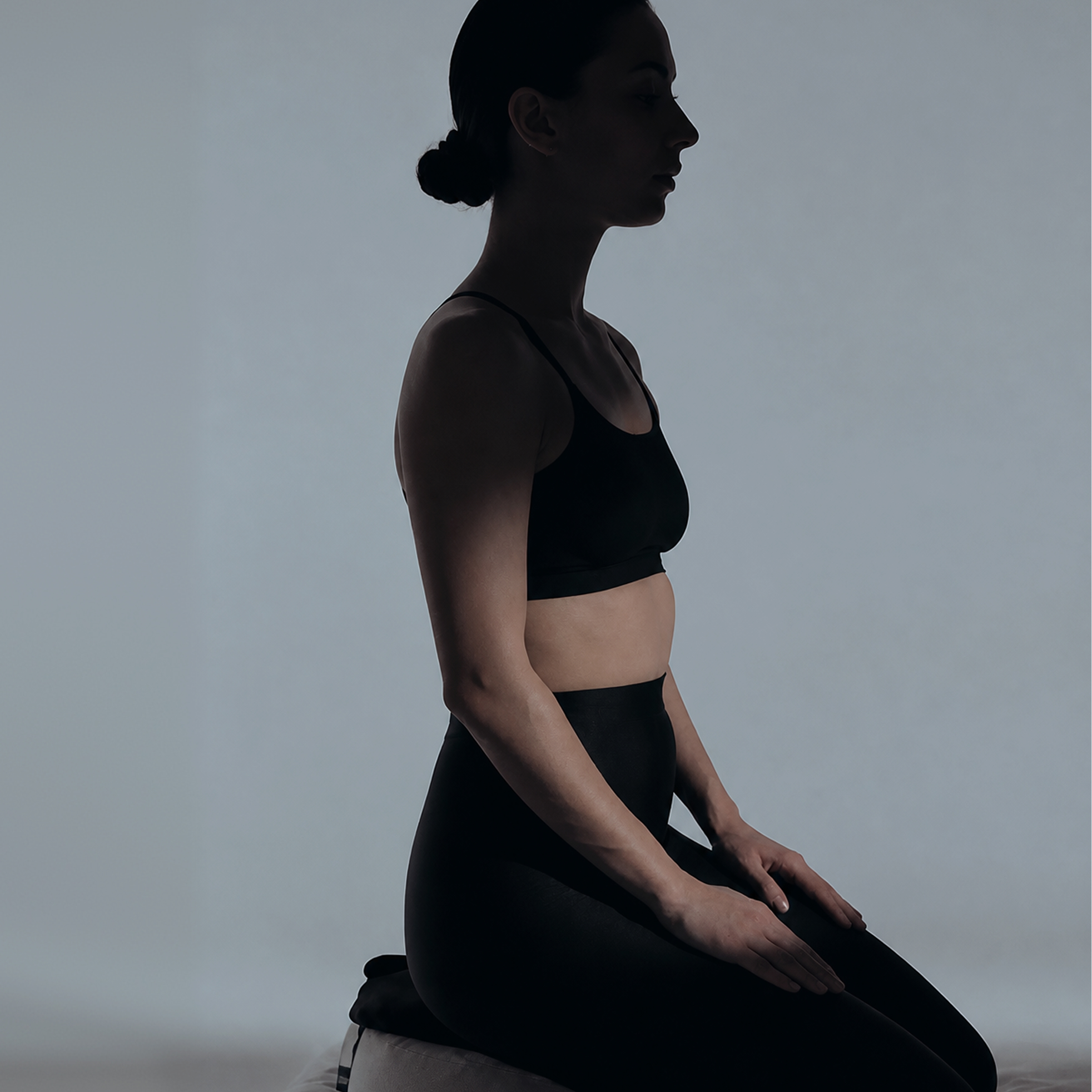 A woman seated in profile