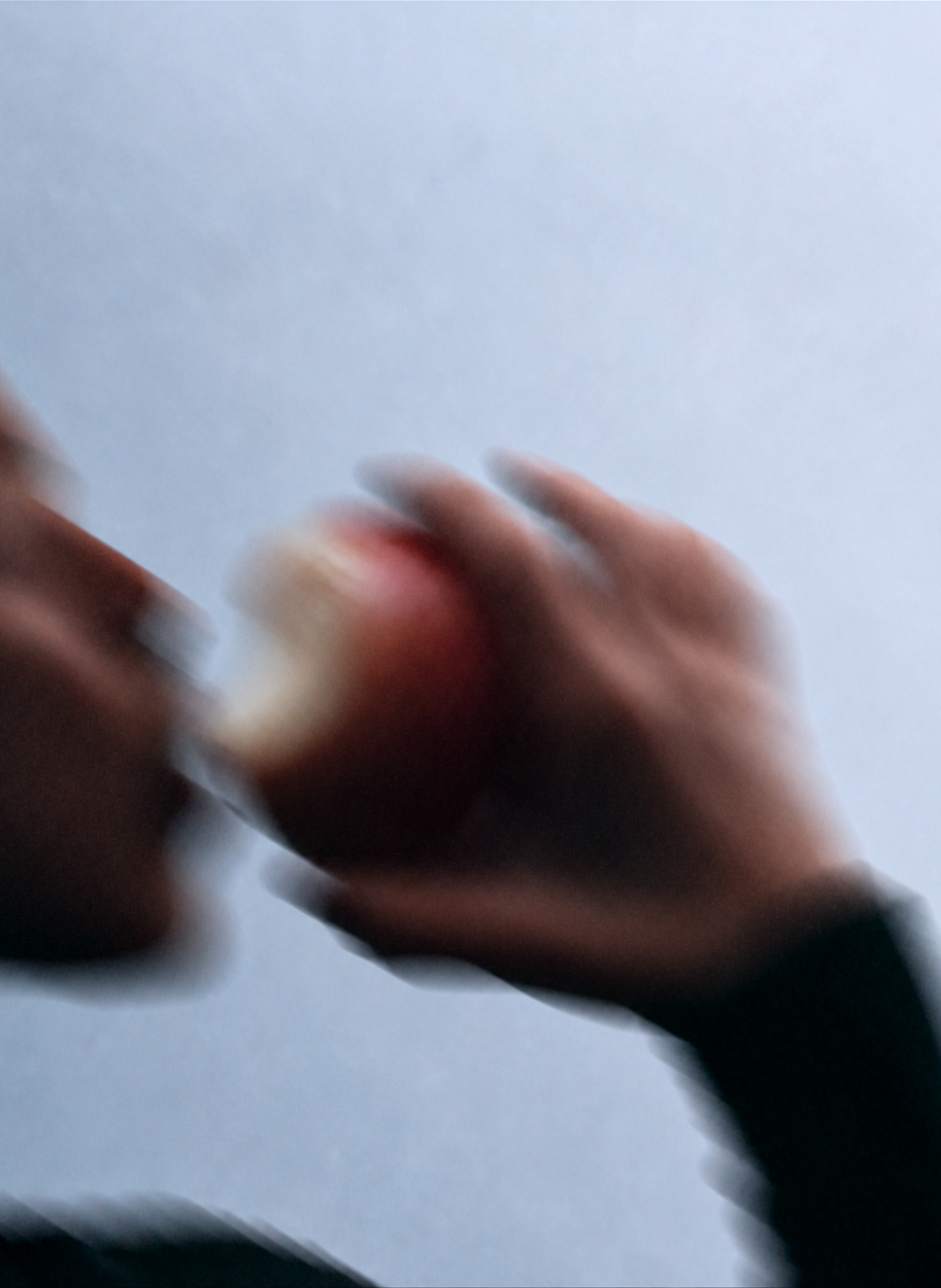 A hand moving across a softly lit surface