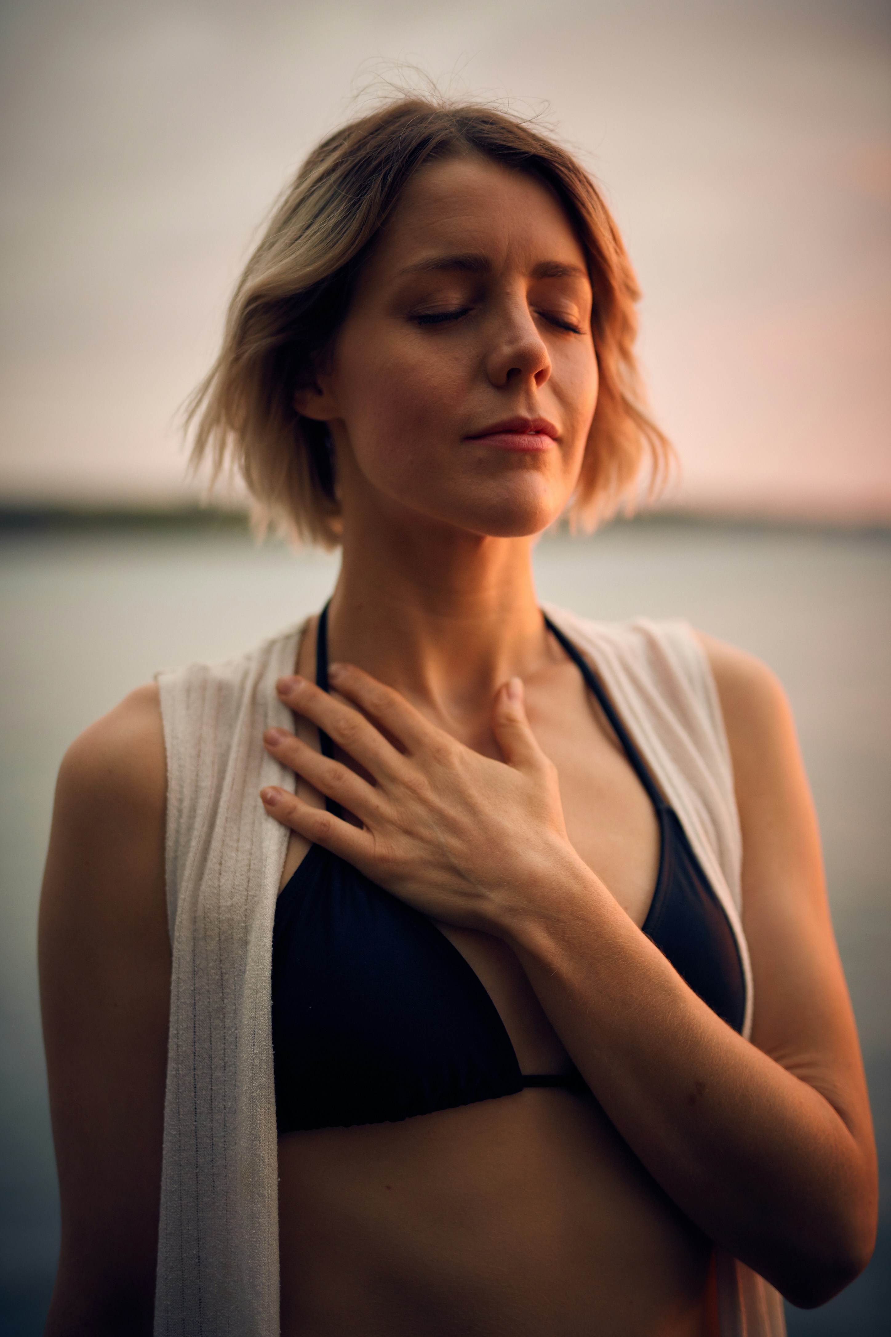 A woman pausing to feel her breathing